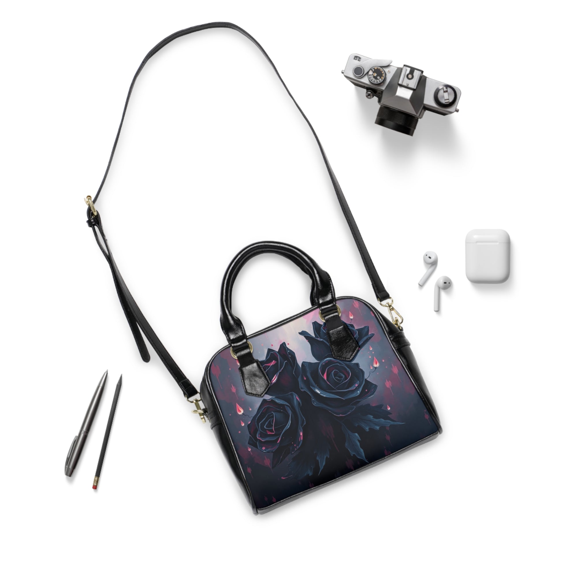 Stylish Midnight Thorn: Shadow Rose Shoulder Bag surrounded by accessories, perfect for a gothic-inspired look.