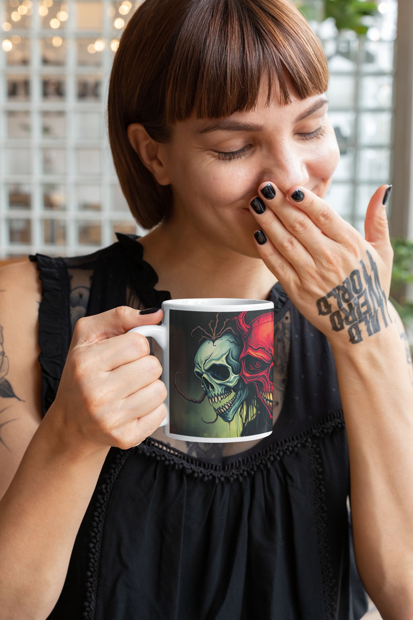 Stylish tattooed woman enjoying coffee from the Infernal Trinity Skull Ceramic Mug with striking skull design.
